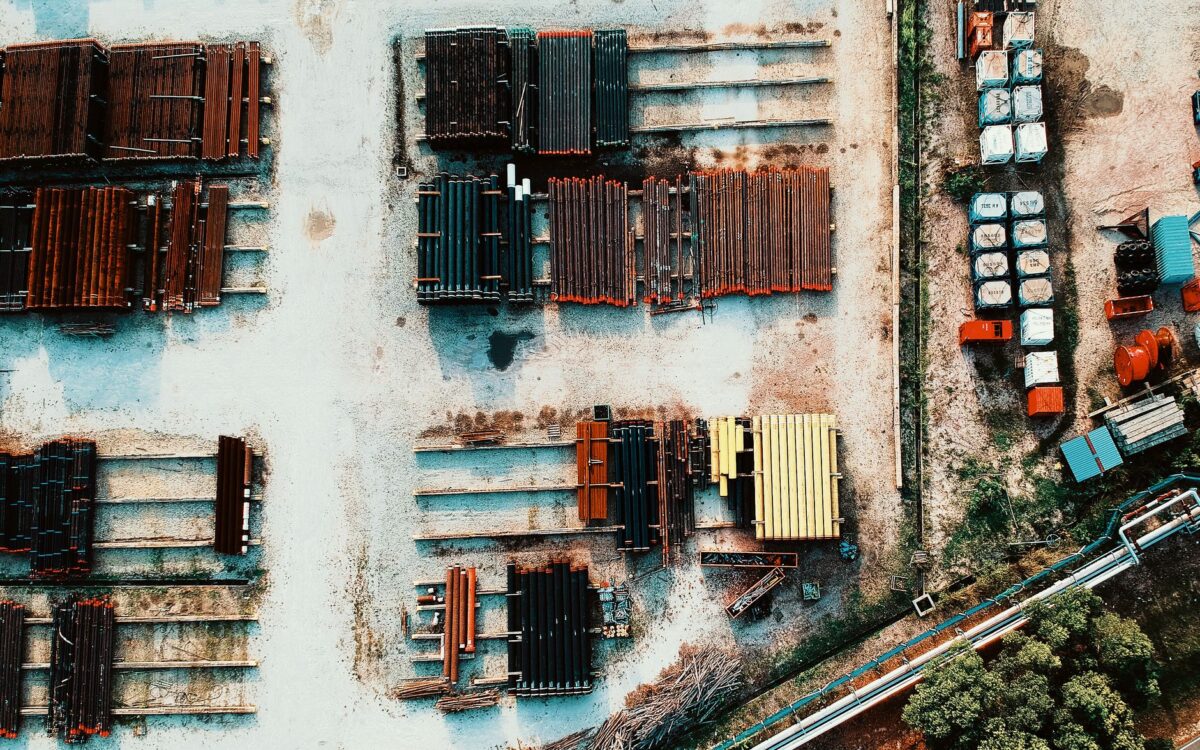 Equipment rental availability Utah showing construction machinery inventory yard with cranes and lifts ready for contractor rental