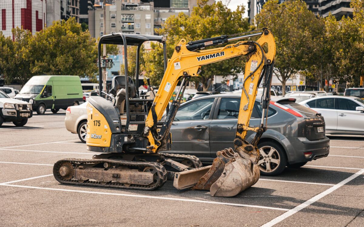 Equipment rental contracts negotiation guide for Utah contractors: heavy machinery and cranes displayed in rental yard