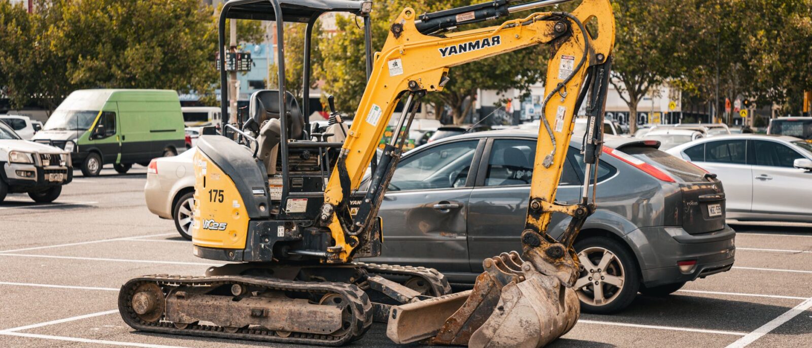 Equipment rental contracts negotiation guide for Utah contractors: heavy machinery and cranes displayed in rental yard