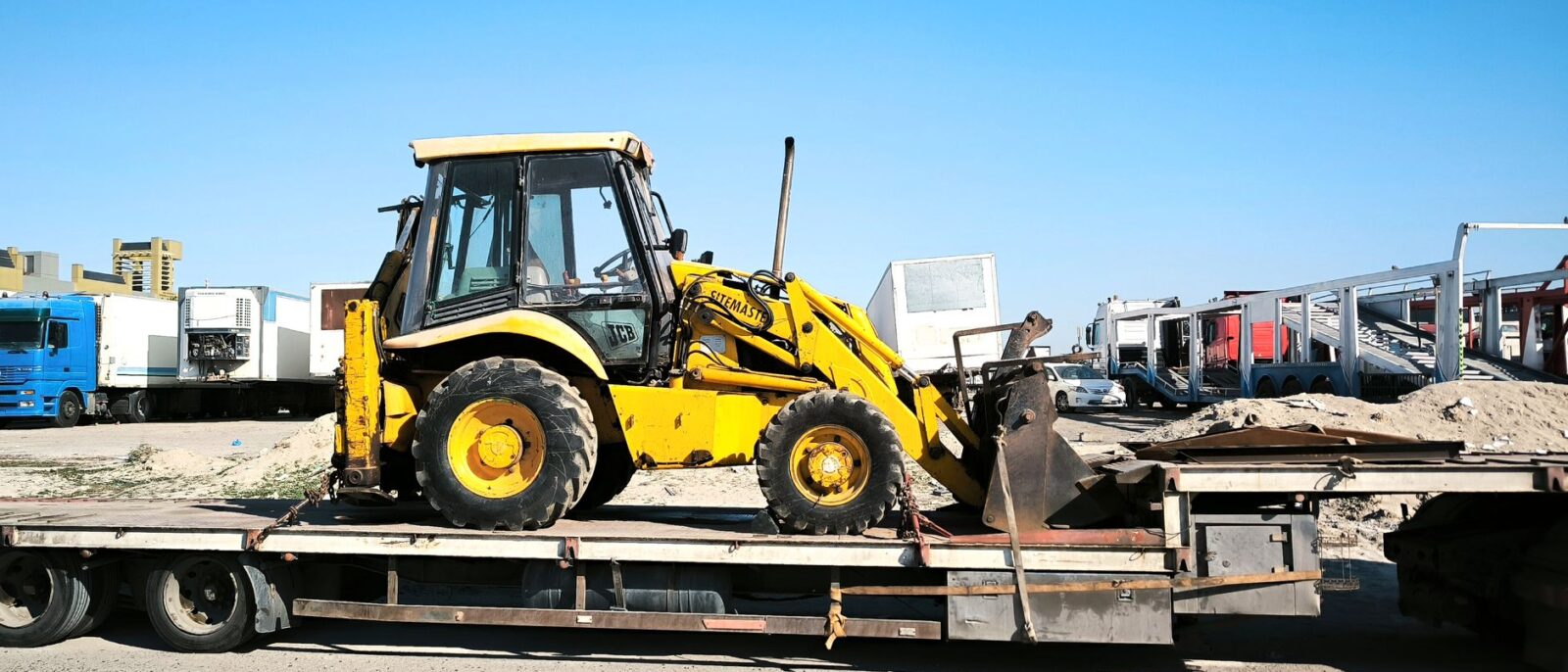 Same-day equipment delivery Utah: Moose Lift Rentals truck delivering aerial lift to construction site