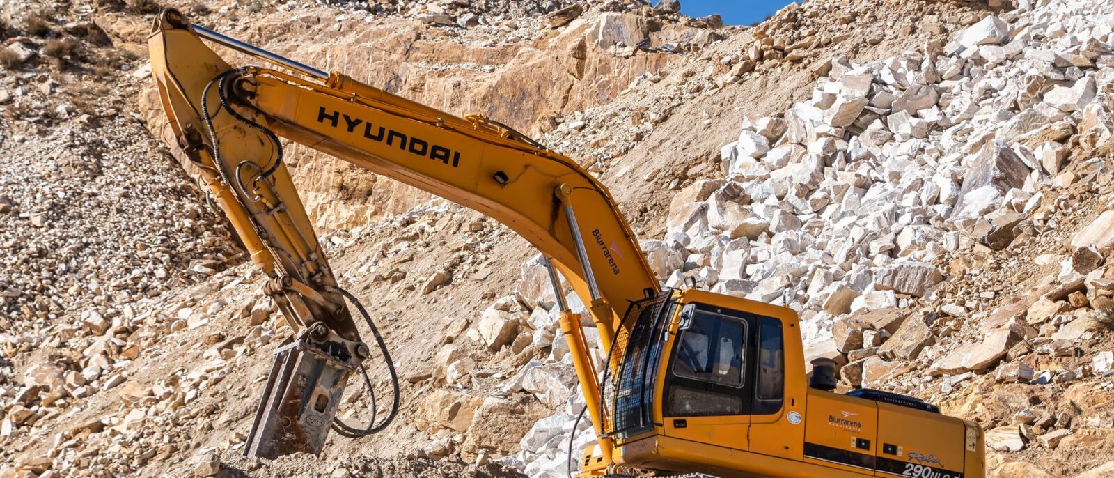 Construction equipment delivery truck arriving at Utah job site with same-day rental equipment for contractors