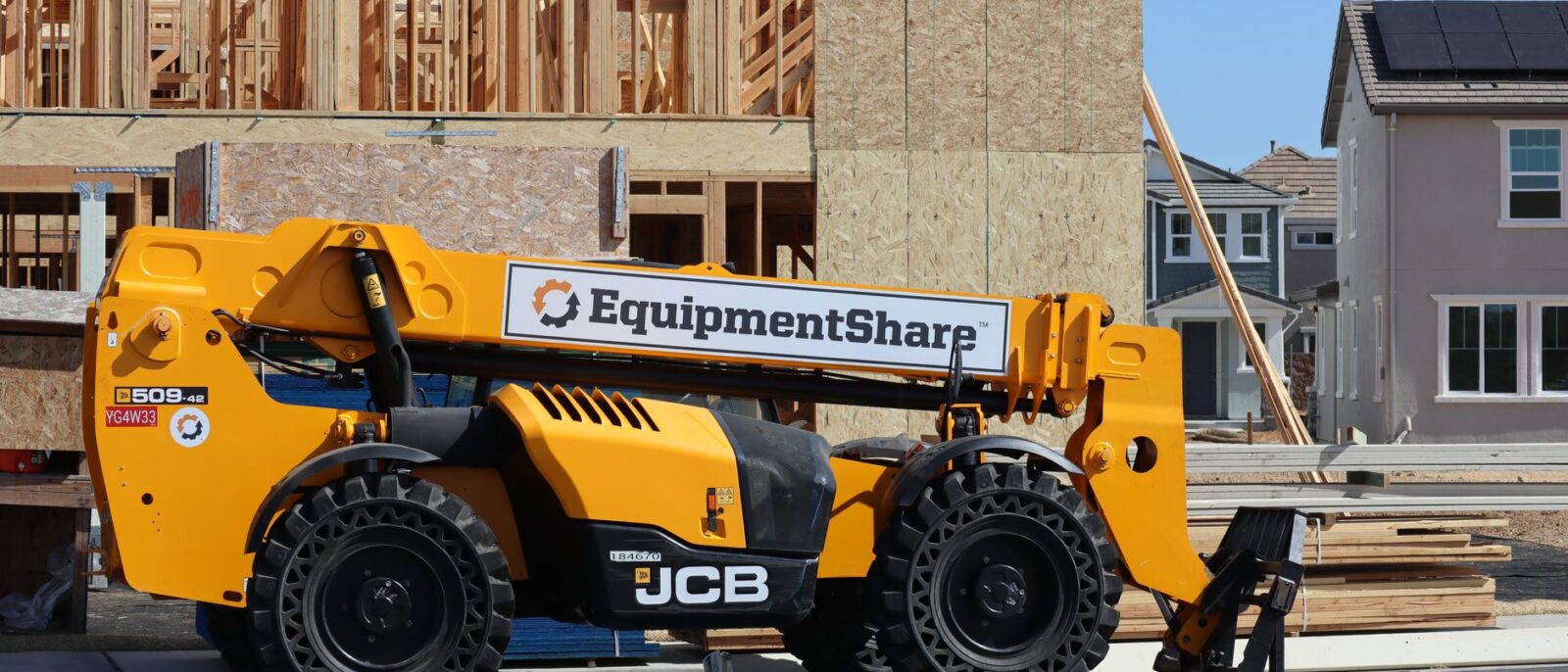 JCB forklift at a construction site in Elk Grove, California. Suburban housing development progress.